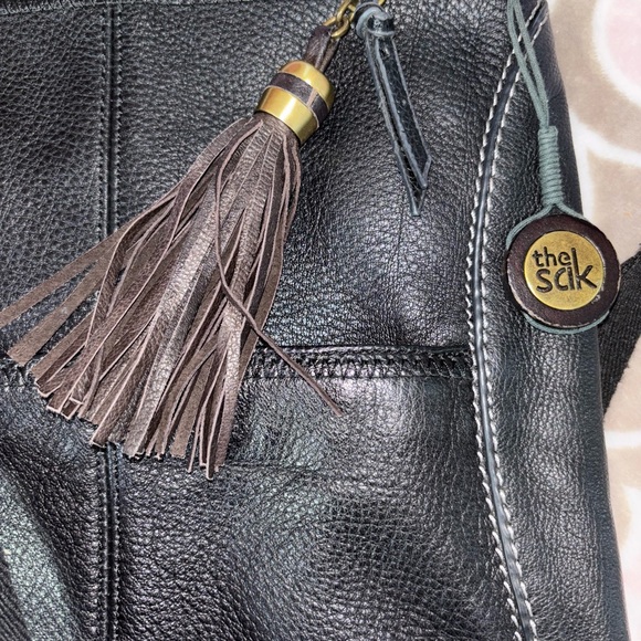 The Sak Black Genuine Leather Tassel Crossbody with Peace Print Interior - Picture 7 of 9